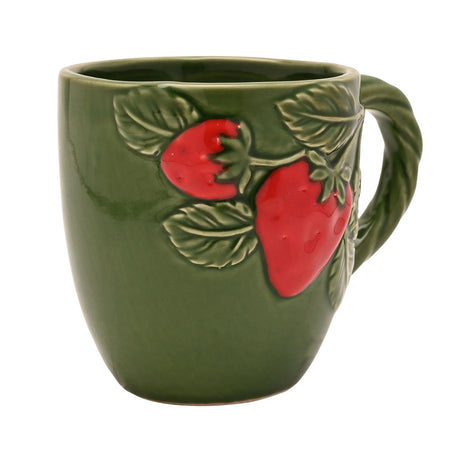 Green ceramic mug with raised red strawberries and sculpted leaves on the front, featuring a twisted rope-style handle, shown on a plain white background.