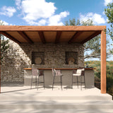 Teja Rope Outdoor Bar Stools with armrests and seat cushions, dark frame and woven rope detailing, shown at a stone bar counter under a wooden pergola.