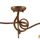 Close-up of the Mantra Tentacle semi-flush ceiling light canopy, showing the rustic gold metal mount and curved arms with a sculptural coiled centre detail.