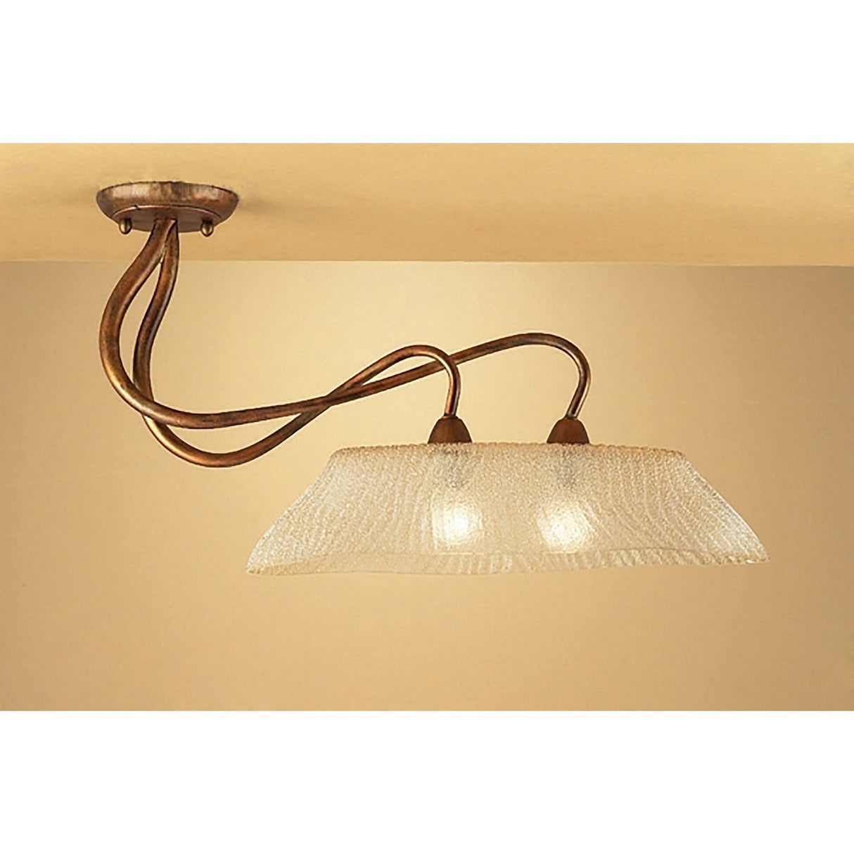 Mantra Tentacle 2 light semi-flush ceiling light with curling rustic gold arms and a frosted amber glass shade, mounted to a warm-toned ceiling.