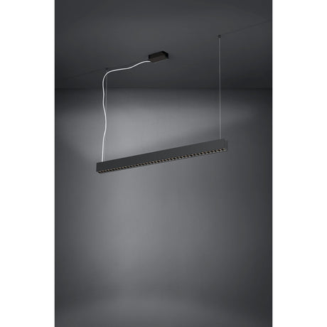 Termini Pendant Light 106.5cm in black steel, a slim linear bar with recessed LED lenses, suspended on wires from a rectangular ceiling canopy against a grey background.