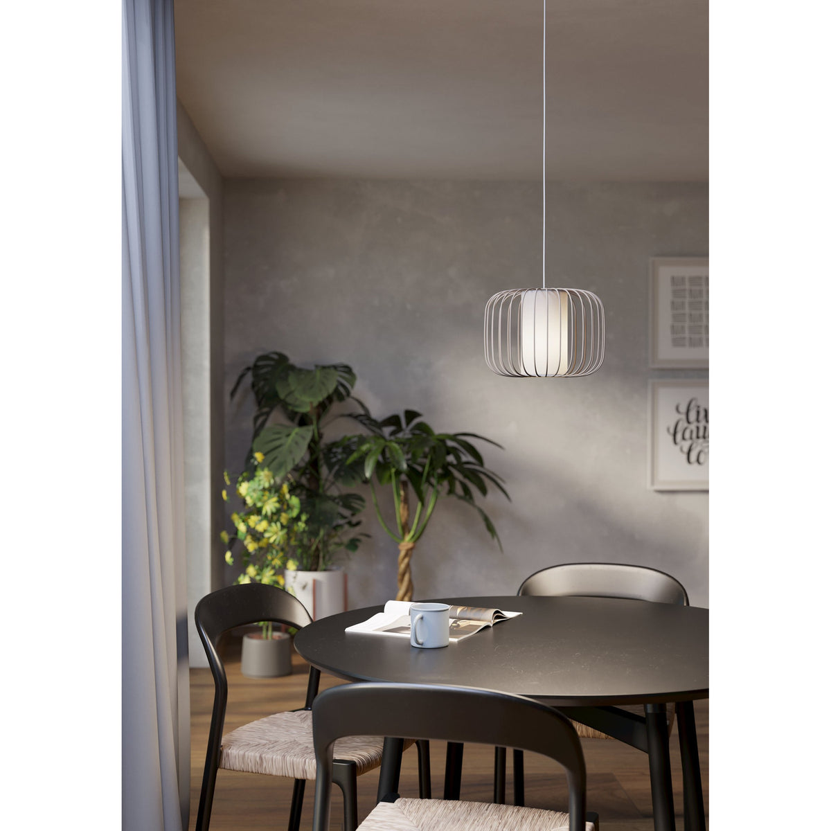 Terrarosa fabric pendant light in sand, a rounded drum cage of slim steel rods over a white fabric shade, shown hanging above a dining table in a neutral-toned room.