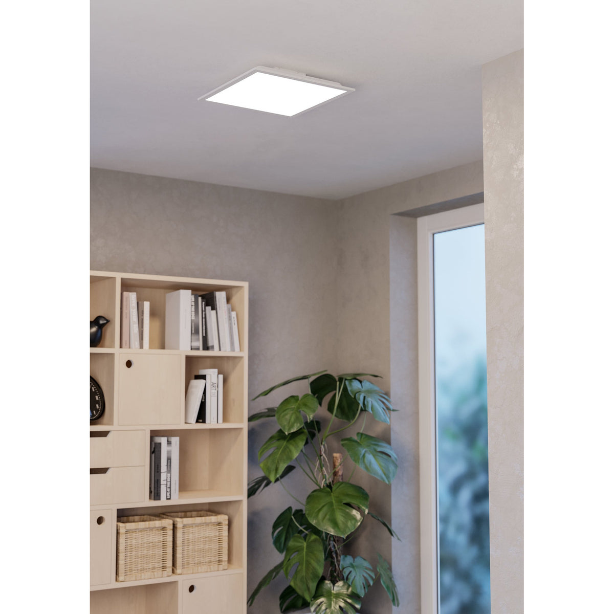 Square white LED ceiling panel light, Tesvelle 39.3 x 39.3cm, flush-mounted in a hallway near a bookshelf, plant, and window.