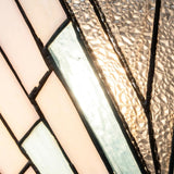 Close-up of the Alderley 2 Light Wall Uplighter in Vintage Bronze, showcasing an Art Deco geometric design with textured, frosted, and clear glass in pastel pink, blue, and neutral tones. Sunlight gently highlights the intricate patterns of the stained glass window.