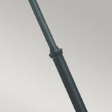 A close-up of the Turin Large 2 Light Twin Lamp Post in sleek black die-cast aluminum, showcasing its cylindrical form with a subtle bend. Positioned against a gray background, the lamp post features a central joint or clasp, hinting at its adjustable or extendable nature, which makes it perfect for outdoor lighting applications.