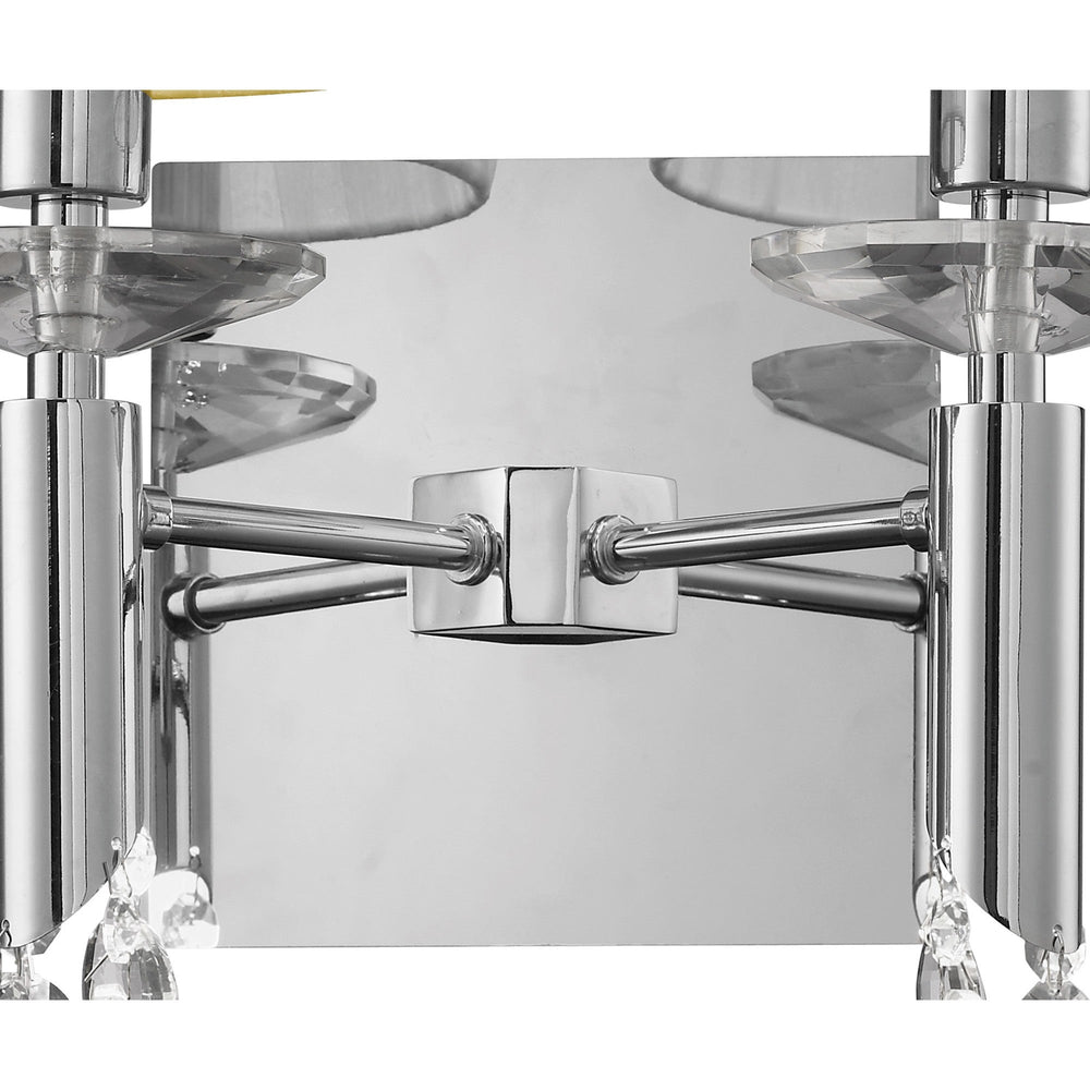 Close-up of Tiffany 2 Light Crystal Wall Light backplate in polished chrome, showing twin arms, faceted crystal discs and droplets beneath cream shades.