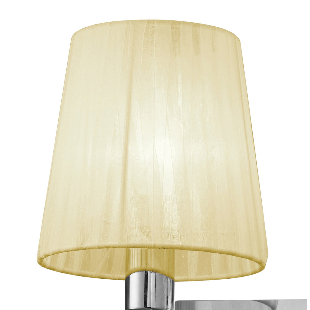 Close-up of the Tiffany wall light's cream pleated fabric shade on a polished chrome fitting, set against a plain white background.