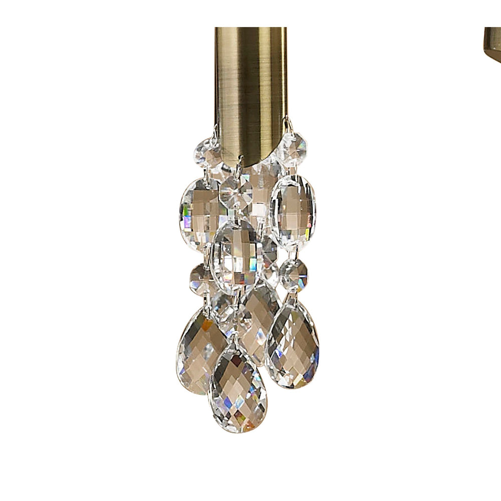 Close-up of crystal droplet strand and antique brass column on the Tiffany 12 Light 2 Tier Crystal Chandelier.