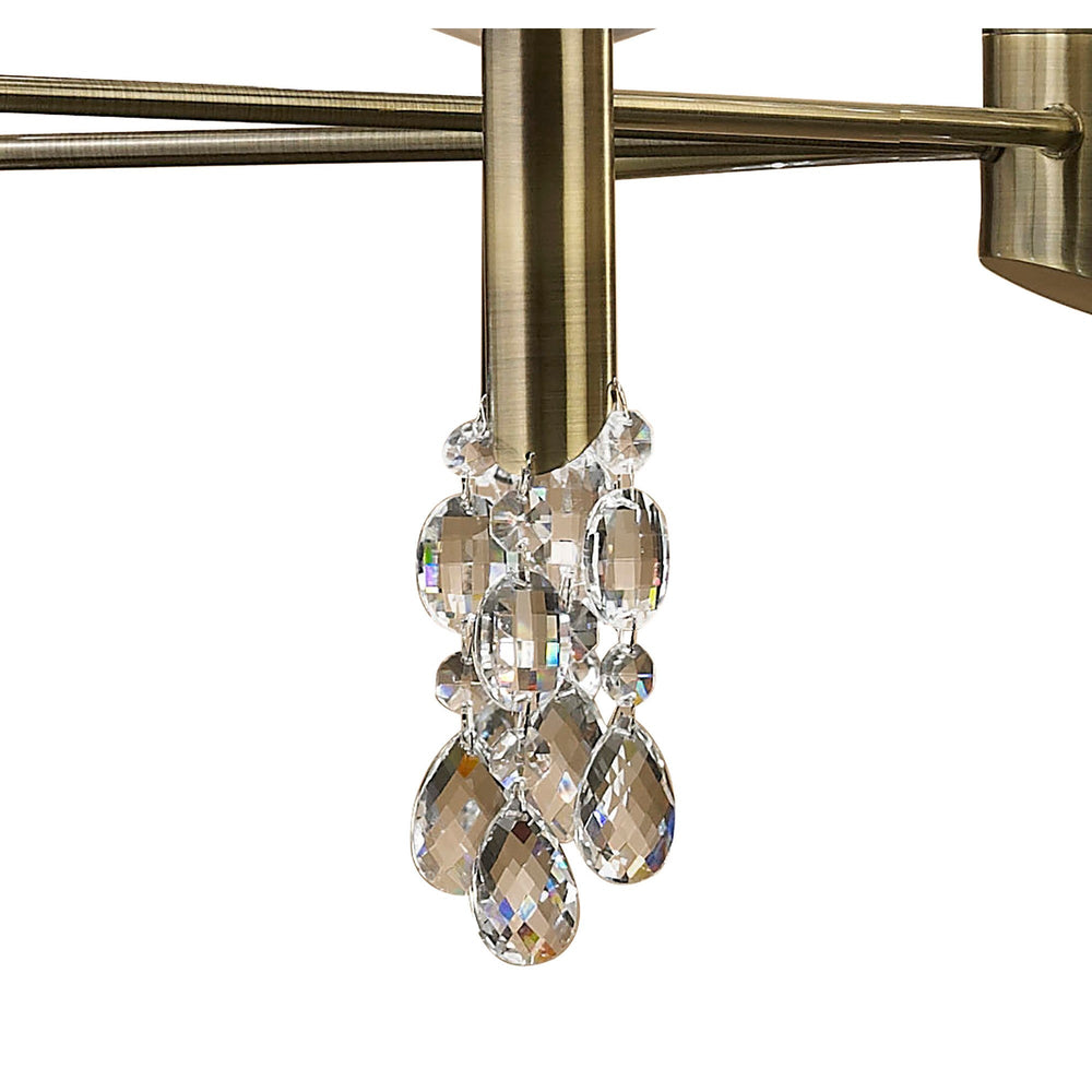 Close-up of crystal droplet cluster and antique brass arm detail on the Tiffany 12 Light 2 Tier Crystal Chandelier.
