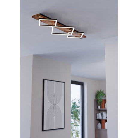 Timarne 3 Light Flush Ceiling Light in black and rustic brown wood, with three overlapping square LED frames shown installed on a hallway ceiling above an arched wall print.