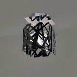 Mantra Tokio semi-flush ceiling light with laser-cut black acrylic geometric cage, central crystal shade, and polished chrome square canopy.