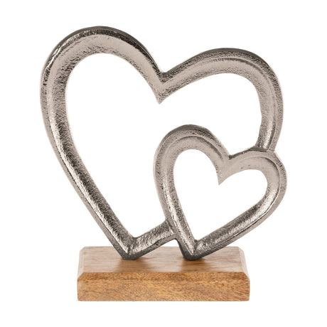 Tomamae decorative heart figurine, two open hearts in textured silver aluminium joined on a rectangular natural mango wood base, shown on a plain white background.