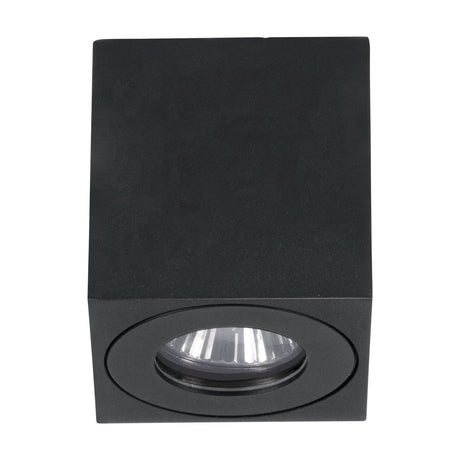 Torrecola Outdoor Wall Light in black, a cube-shaped aluminium and plastic fixture with a round bezel and clear glass cover over a single GU10 downlight, shown on a white background.