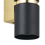 Close-up of the Tramena Wall Light in black and gold, showing a matt black steel cylinder with a polished gold band and rectangular backplate on a white background.