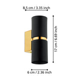 Tramena wall light with two matt black steel cylinders joined by a polished gold band on a gold backplate, shown with dimensions 8.5cm projection, 6cm width and 17cm height on a white background.