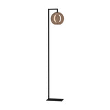 Trelbette Floor Lamp with a slim black steel stand, square base, right-angled arm, and a round copper-finish glass globe shade, on a plain white background.