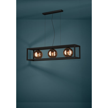 Trelbette 3-light linear pendant with an open black steel rectangular frame and three mirrored copper-tone glass globes, suspended against a dark teal wall.