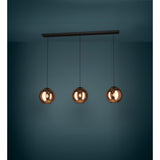 Trelbette 3-light linear pendant with black steel bar and cords suspending three copper-toned mirrored glass globe shades, lit against a dark teal background.