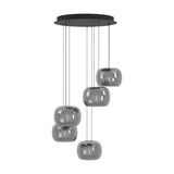 Hortunas 5-light cluster pendant with round black steel ceiling canopy and smoked glass shades at staggered heights on black cables, shown on a plain white background.