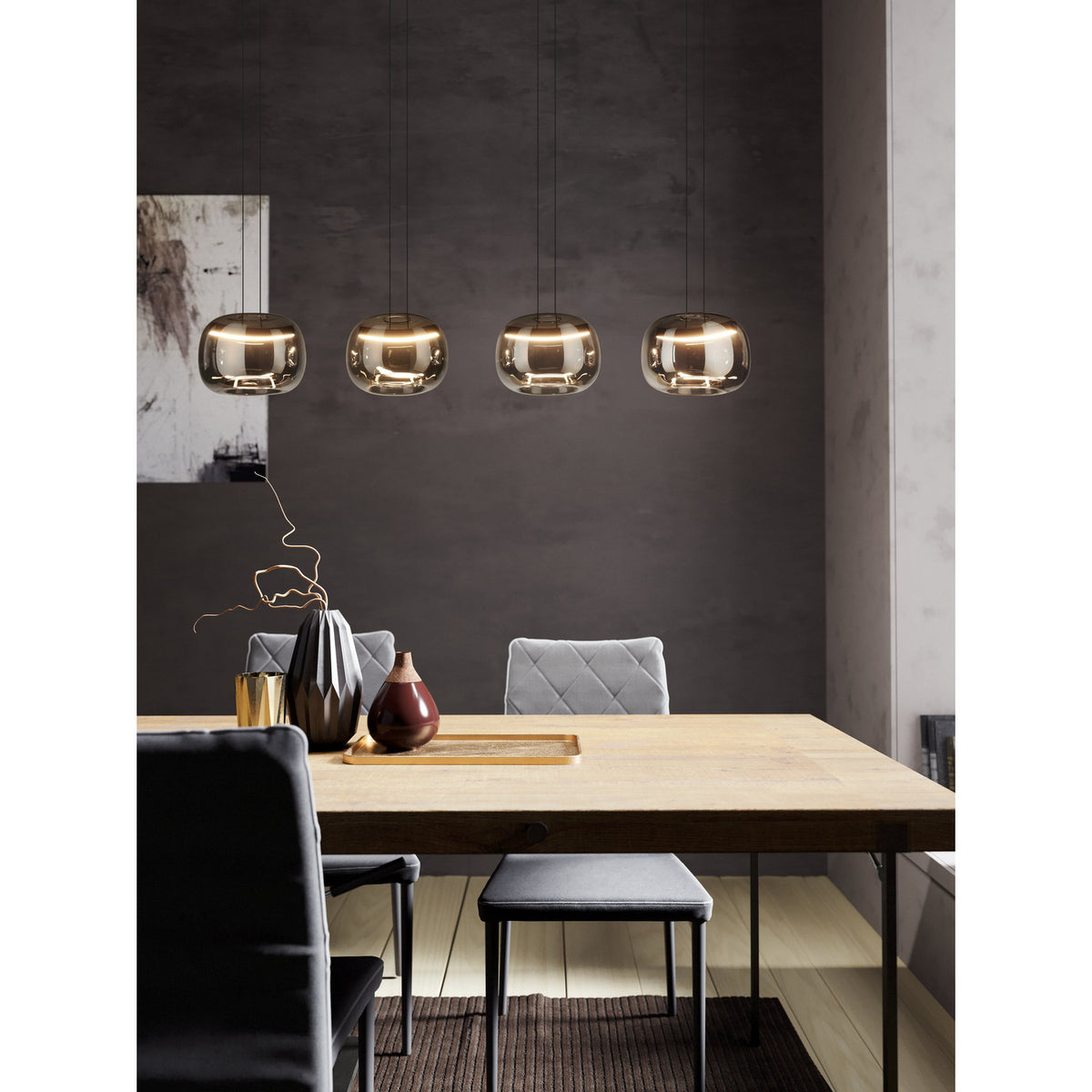 Hortunas Smoked Glass Linear Pendant Light in black, four rounded smoked glass shades on black cords suspended over a wooden dining table, LED warm-white glow.