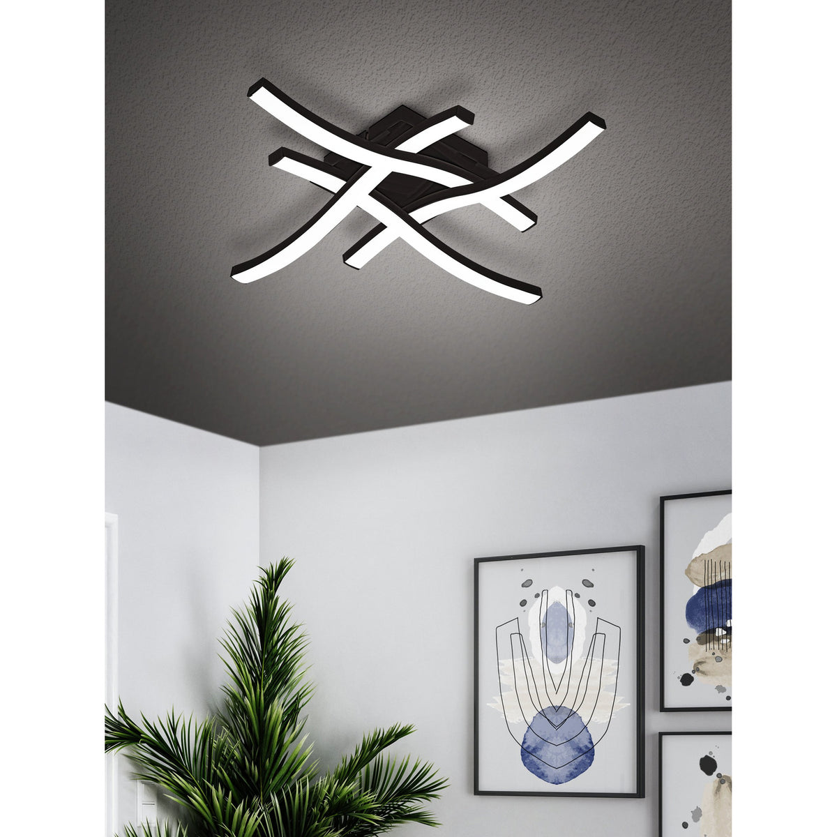Trosmessa LED 4 Light Flush Ceiling Light in black with four crossing curved arms and white LED strips, shown mounted on a textured grey ceiling above a modern hallway.