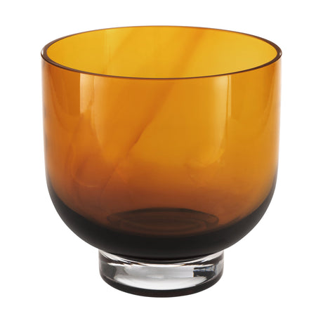 Tudiya Glass Vase 20cm in Amber, a wide round bowl with straight sides, clear glass foot, and swirled amber tones deepening towards the base, shown on a plain white background.