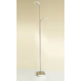 The Udine 2 Light Frosted Glass Floor Lamp in satin chrome features a square metal base, dual slender poles, and upward-facing frosted glass shades set at staggered heights against a plain beige background.