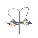 The Ull 2 Light Floor Lamp - Silver features a modern, industrial design with two dome-shaped lights on curved arms extending from a central pole, providing striking ambient lighting.