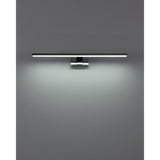 Varette 60cm LED bathroom mirror light in chrome, slim horizontal bar on a central wall bracket, illuminated with a soft downward glow against a plain grey wall.