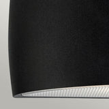 Close-up of the Vasa Outdoor 1 Light Wall Light in a sleek graphite finish, crafted from die-cast aluminum and showcasing its smooth cylindrical shape with a partial view of the light diffuser at the bottom. Perfectly suited as an outdoor wall light with an IP65 rating, it stands out against a neutral gray background.