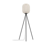 Vavanne tripod floor lamp with tall pleated white paper lantern shade and slim black steel tripod legs, shown on a plain white background.