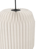 Close-up of the Vavanne Paper Linear Pendant Light showing one white paper shade with deep vertical pleats, suspended from a black steel ceiling plate and rod, on a plain white background.