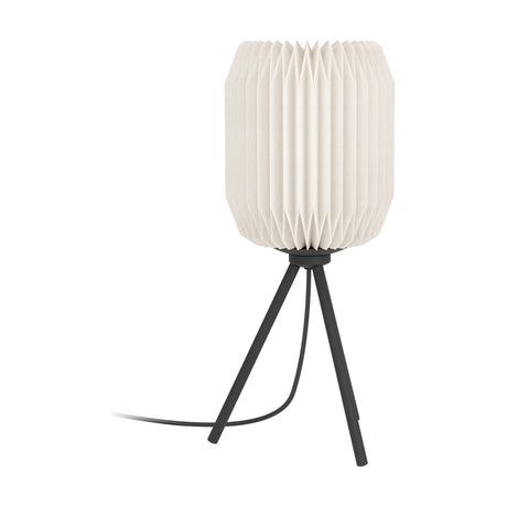 Vavanne table lamp with a pleated white paper lantern-style shade on a slim black steel tripod base, shown on a plain white background.