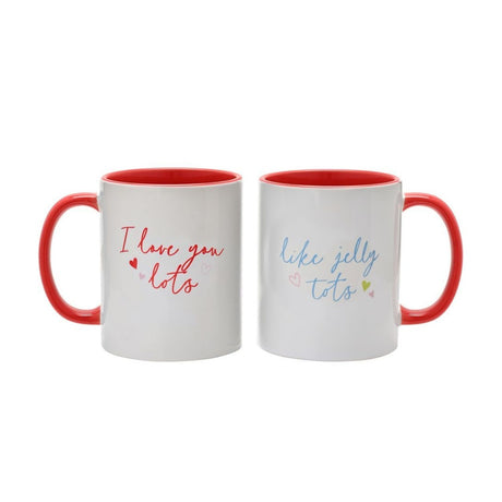 Pair of white ceramic mugs with red handles and red interiors, reading "I love you lots" and "like jelly tots" in red and blue script with small heart details, on a plain white background.