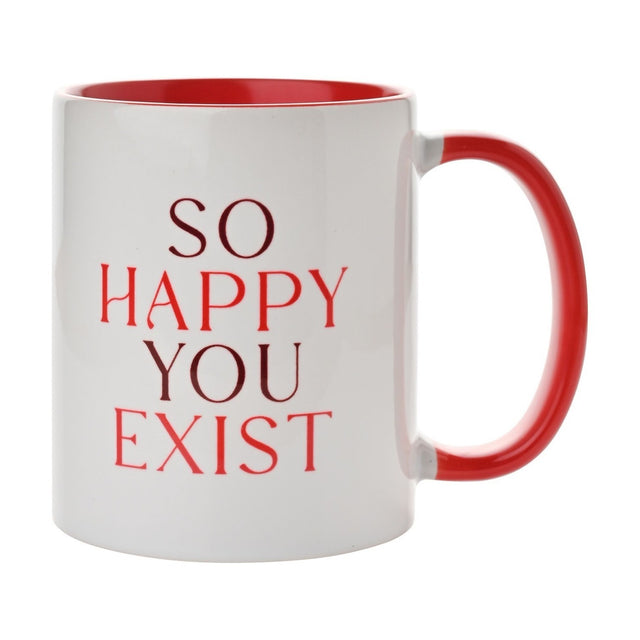 White gloss earthenware mug with red interior and handle, printed "So Happy You Exist" in wine and bright red serif lettering, shown on a plain white background.