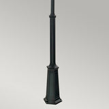 The Valencia Large 2 Light Twin Head Lamp Post in black, made from die-cast aluminum with a decorative base, is showcased against a plain gray background. Its square-shaped pedestal and simple, elegant design make it an ideal choice for outdoor lighting.