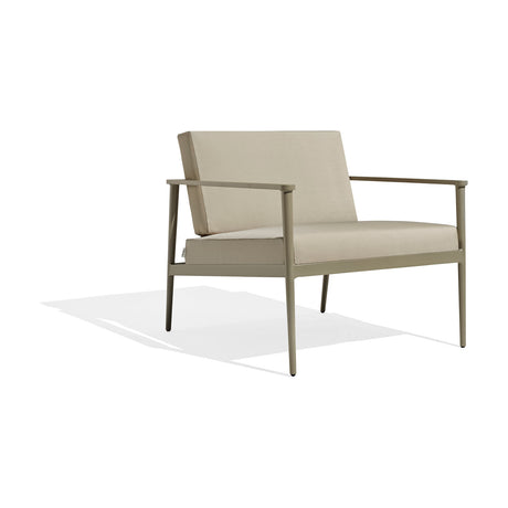 Vint Aluminium Garden Armchair with beige cushions and a slim, tapered khaki-green aluminium frame, shown on a plain white background.