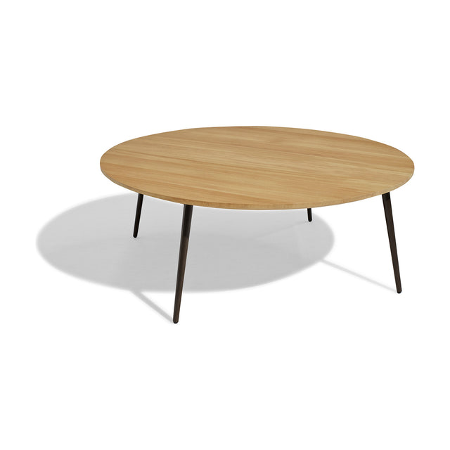 Vint Round Aluminium Outdoor Coffee Table in 110cm, featuring a light wood-finish round top on slim tapered dark metal legs, shown on a plain white background.