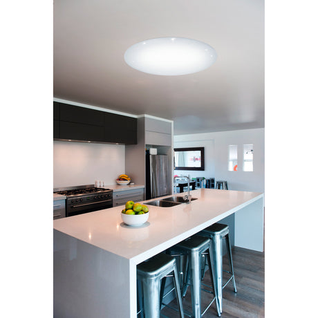Vinvanne large round LED flush ceiling light, 76cm, white finish with crystal-effect diffuser, shown illuminated on a kitchen ceiling above a white island.