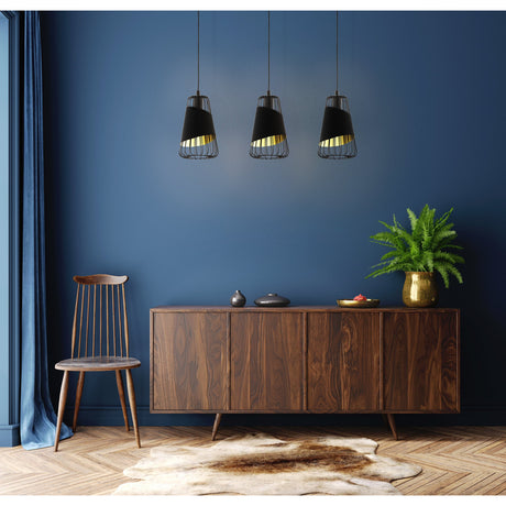 Vivessa Fabric Linear Pendant Light in black, three tapered fabric and steel cage shades with gold lining, hung above a wooden sideboard in a dark blue dining room.