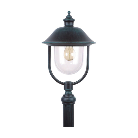 Volute outdoor lamp post lantern head with dark green cast frame, curling scroll bracket, clear glass panels and copper-toned domed roof, shown on a plain white background.