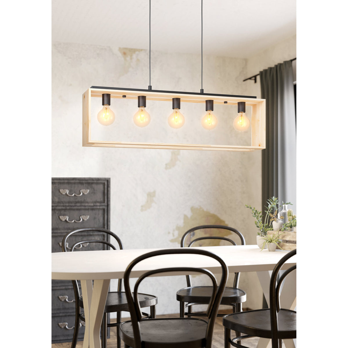Vonelle Linear Pendant Light in black and natural wood, five E27 bulbs along a steel bar above an open rectangular wood frame, shown hanging over a dining table.