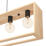 Close-up of the Vonelle Linear Pendant Light, showing a natural wood frame with black E27 lampholders and exposed filament bulbs against a white background.