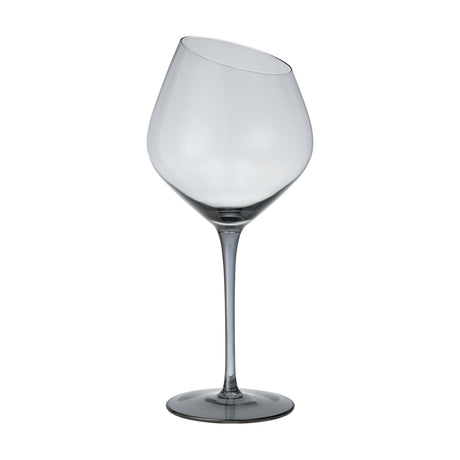 Vrede Red Wine Glass with a tall stem, round foot, and generous balloon bowl in smoke-grey tinted glass, featuring a slanted rim cut, shown against a plain white background.