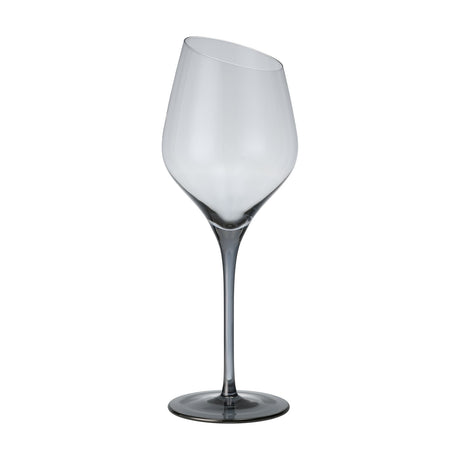 Vrede White Wine Glass, a stemmed glass with an angled slanted rim, smoke-tinted bowl, and long slender stem deepening to a darker grey foot, shown on a plain white background.