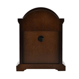 Rear view of the Broken Arch Roman Dial Wooden Mantel Clock in walnut, showing the plain wood back panel with a round access port, set on a shaped base against a white background.