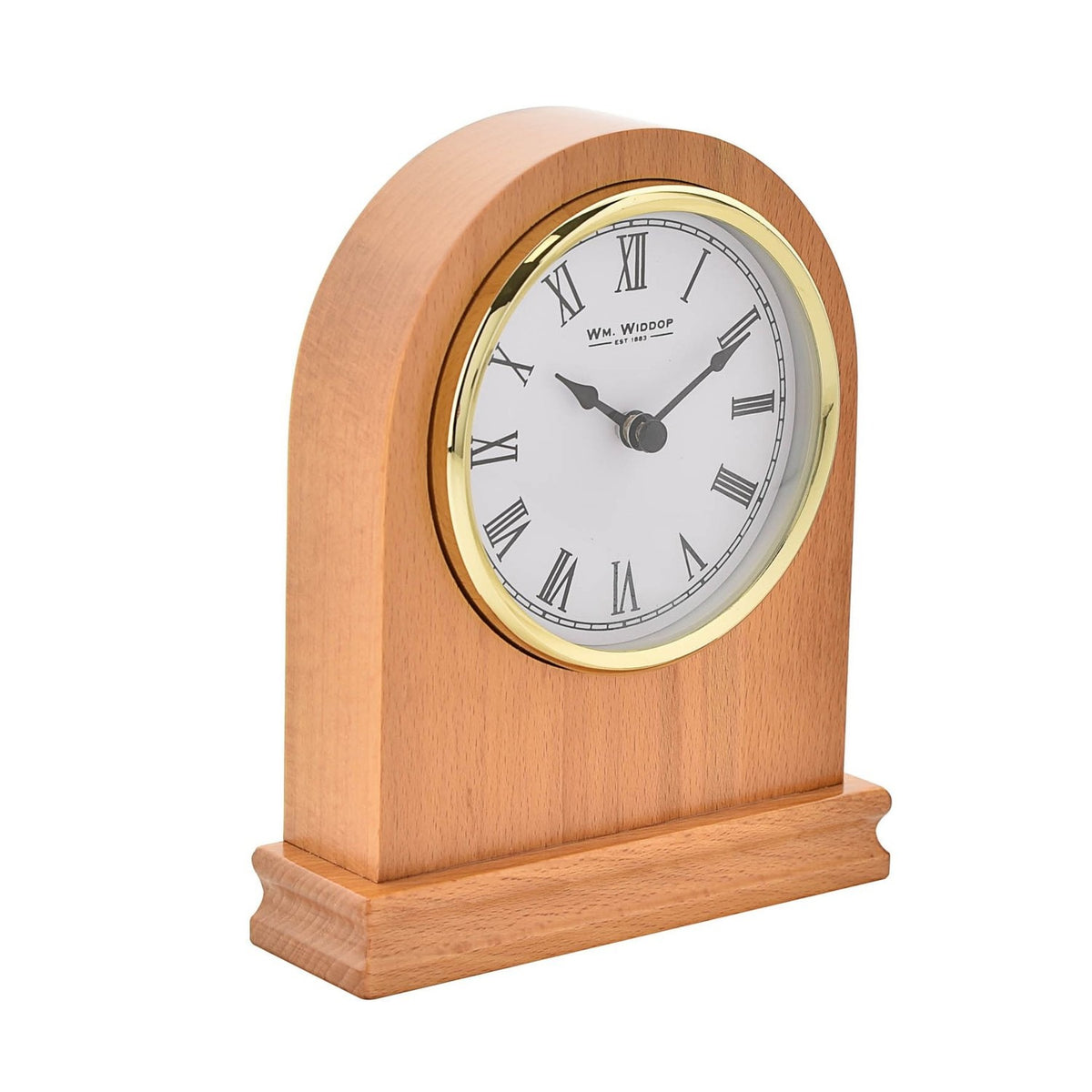 Arched wooden mantel clock in oak with rounded top and plinth base, featuring a white Roman numeral dial in a gold-coloured bezel and black spade hands, shown on a plain white background.