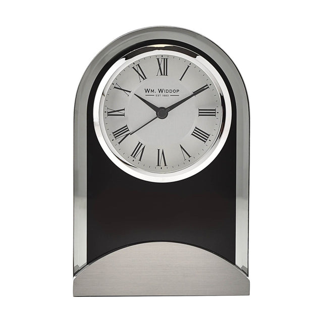 Arched mantel clock with black glass panel and bevelled edge, round silver bezel, Roman numeral dial, and brushed aluminium base, on a plain white background.