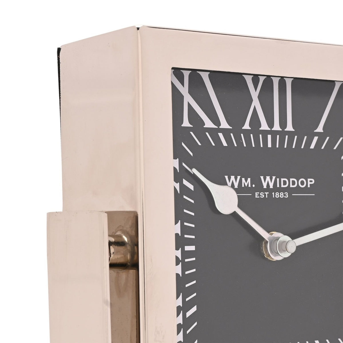 Close-up of a square mantel clock with silver frame and stand, black dial, white Roman numerals, and silver hands, set against a plain white background.
