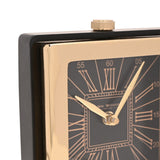 Close-up of the Square Roman Numeral Mantel Clock in gold, showing the black dial, gold Roman numerals, minute track, and gold hands within a polished gold case and black surround.